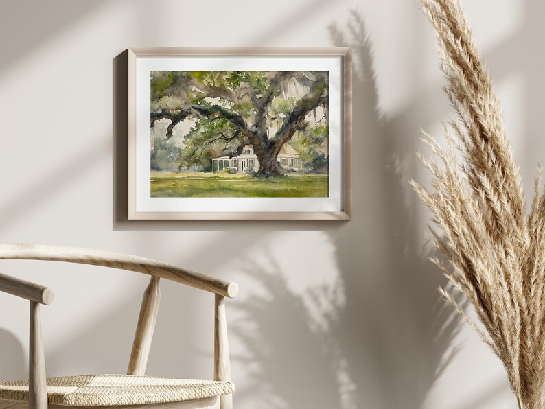 May include: A watercolor painting of a white house with a large oak tree in the front yard. The house has a porch and a roof with a slight overhang. The tree has many branches and leaves, and the painting is done in shades of green, brown, and white.