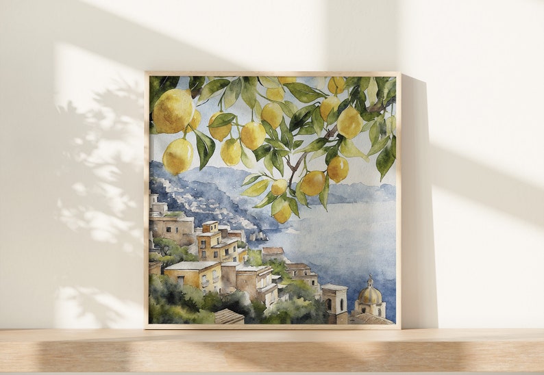 May include: Watercolor painting of a lemon tree with ripe yellow lemons hanging from the branches. The tree is situated on a hillside overlooking a blue ocean and a small town with yellow buildings.