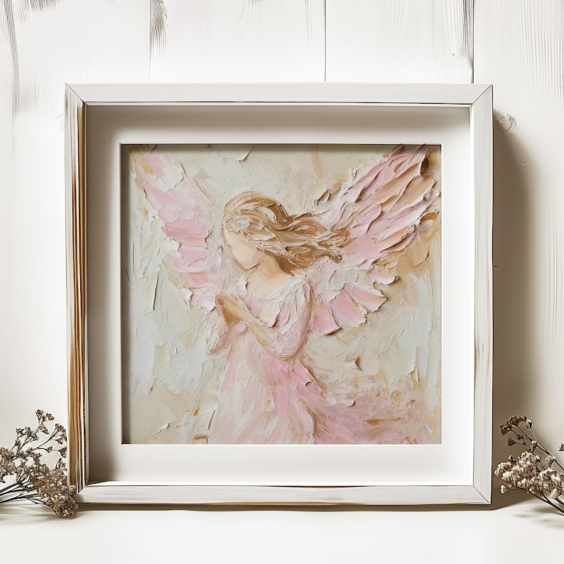 May include: A framed painting of an angel with pink wings and a white dress. The angel is painted in a textured style, with visible brushstrokes. The background is a soft beige color.