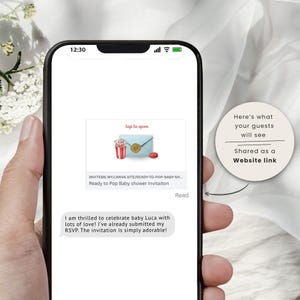 May include: A smartphone screen displays a baby shower invitation. The invitation features a blue envelope, a red cup with straws, and a red button. Text on the screen reads "Ready to Pop Baby shower Invitaiton".