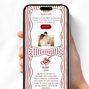 May include: A smartphone displays a baby shower invitation with red and white striped borders. The invitation includes an RSVP section, a photo of a couple, and a baby registry section. Text on the screen reads "WEB INVITE" and "INVITATION made easy."