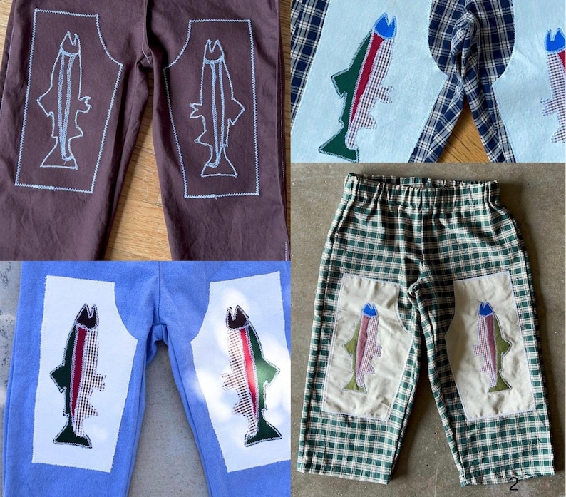 May include: A collection of four pairs of pants featuring fish-shaped patches on the legs. The pants include brown, light blue, and green plaid fabrics, with some patches showing white outlines and others displaying colorful checkered fish patterns.