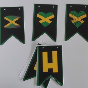 May include: A set of black and green pennant flags with a yellow and green Jamaican flag design. The flags have a heart shape, an 'X' shape, and the letter 'H' in yellow.