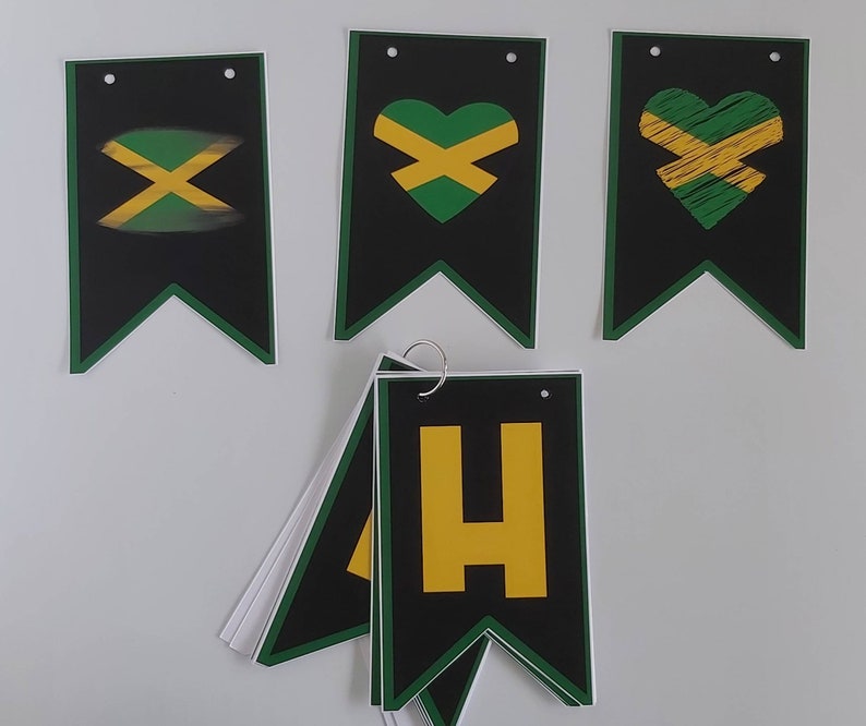 May include: A set of black and green pennant flags with a yellow and green Jamaican flag design. The flags have a heart shape, an 'X' shape, and the letter 'H' in yellow.