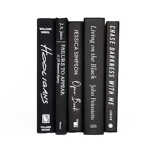 May include: A stack of five black hardcover books with white text titles. The titles are "Hooligans", "Failure to Appear", "Open Book", "Living on the Black", and "Chase Darkness with Me".