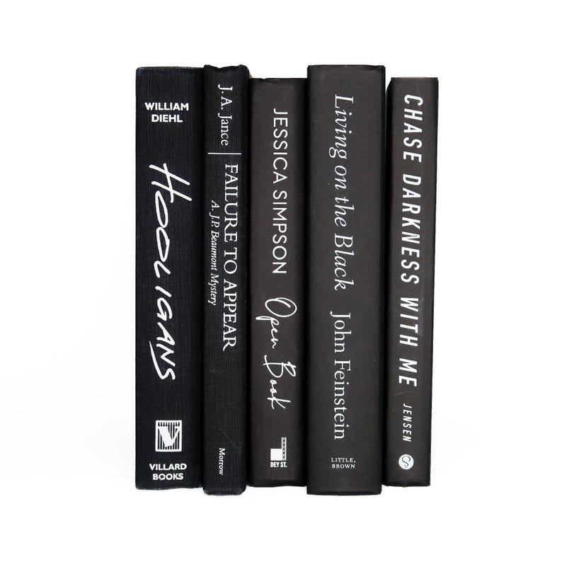 May include: A stack of five black hardcover books with white text titles. The titles are "Hooligans", "Failure to Appear", "Open Book", "Living on the Black", and "Chase Darkness with Me".