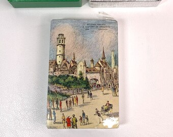May include: A vintage postcard depicting a Belgian Village at the 1934 Century of Progress International Exposition in Chicago. The postcard shows a detailed illustration of the village with a tall tower, buildings, and people walking around.