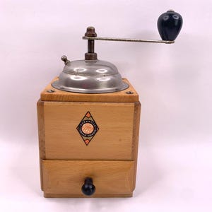 Molinillo de café manual forjado vintage con garantía, fabricado en Alemania Occidental.