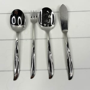 May include: A set of three ceramic mugs with a speckled, matte finish. The mugs are in shades of cream, light gray, and dark gray. Each mug has a simple, minimalist design, perfect for coffee or tea.