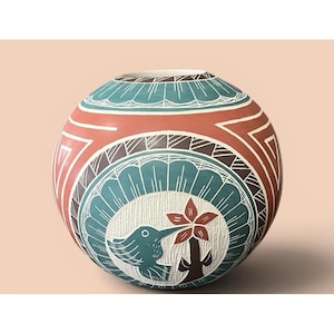 May include: A round, hand-painted ceramic vase with a detailed design. The vase features a hummingbird and flower motif in a central circle, surrounded by geometric patterns in teal, red, and white. The vase has a cream-colored interior.
