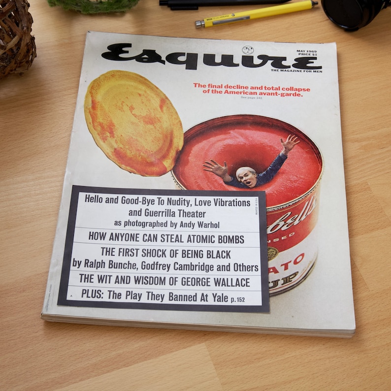 May include: A vintage Esquire magazine cover from May 1969 featuring a red and white can of tomato soup with a man's head and shoulders submerged in the soup. The cover text reads "The final decline and total collapse of the American avant-garde." and "Hello and Good-Bye To Nudity, Love Vibrations and Guerrilla Theater as photographed by Andy Warhol".
