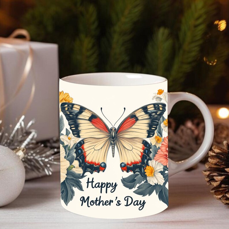 May include: White ceramic mug with a colorful butterfly illustration and floral accents. The mug has the text "Happy Mother's Day" printed on the bottom.