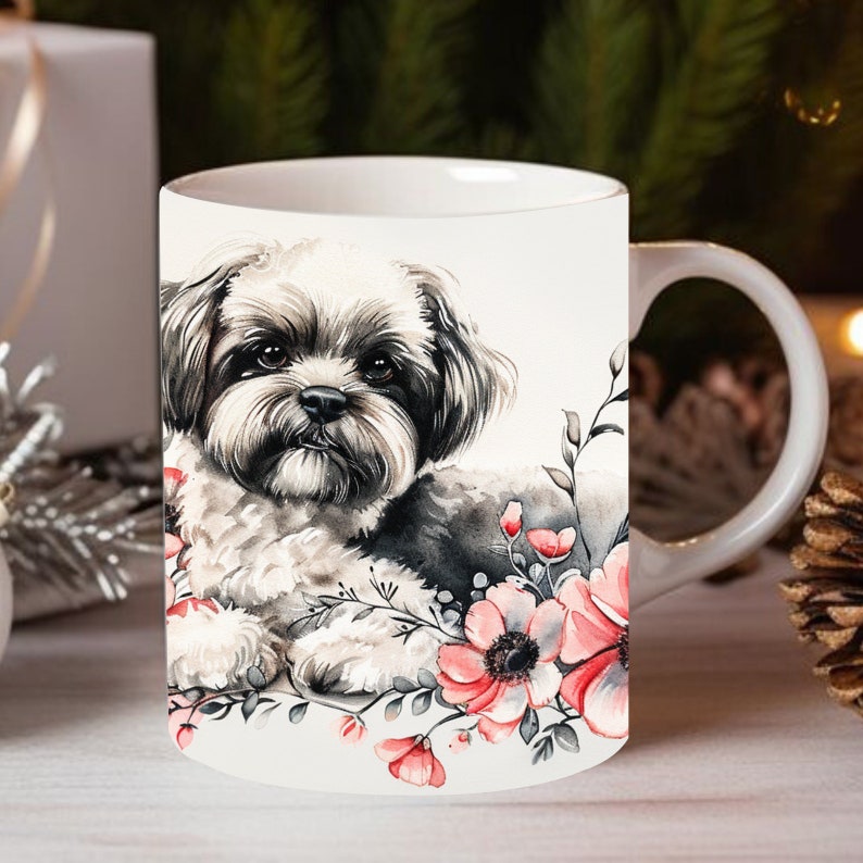 May include: White ceramic mug with a black and white watercolor illustration of a Shih Tzu dog surrounded by pink flowers.