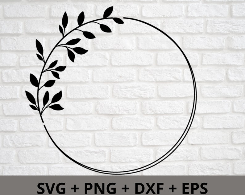 May include: A black and white floral wreath with a circle in the center. The wreath is made of leaves and branches.