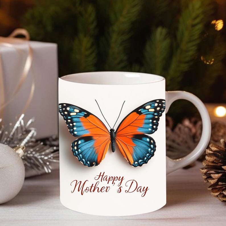 May include: White ceramic mug with a blue and orange butterfly design and the text "Happy Mother's Day" in red.