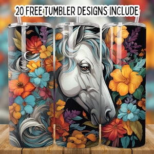 May include: A white horse head with a floral design on a black background. The flowers are in shades of orange, yellow, blue, and purple. The design is perfect for a tumbler.