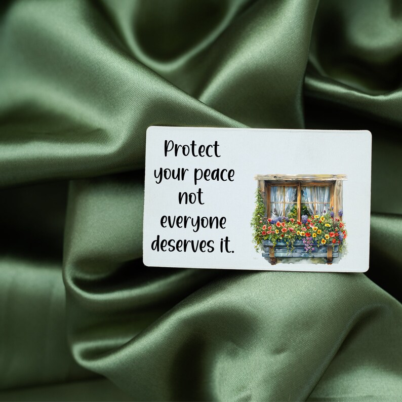 May include: A white card with the text "Protect your peace not everyone deserves it." and a picture of a window with flowers in a window box.