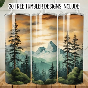 May include: Three stainless steel tumblers with a mountain and forest scene. The scene features a mountain range with snow-capped peaks, a forest of pine trees, and a sunset sky. The tumblers are 20 ounces each.