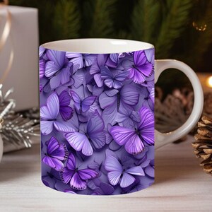 May include: A white ceramic mug with a purple butterfly pattern. The butterflies are arranged in a random pattern and are all different sizes. The mug has a white handle.