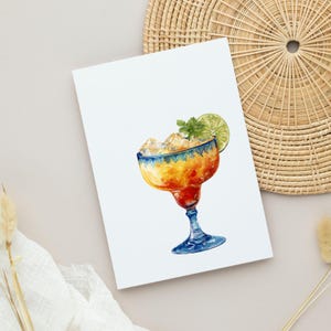 May include: A watercolour illustration of a margarita cocktail in a classic glass. The drink is filled with ice cubes, garnished with a lime slice and mint. The glass has a blue rim and stem, with a red base. The drink is orange and yellow.