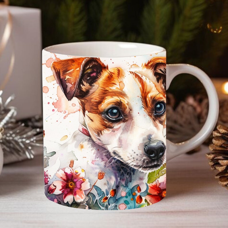 May include: White ceramic mug with a watercolor illustration of a Jack Russell Terrier dog with brown and white fur. The dog is surrounded by colorful flowers and leaves.