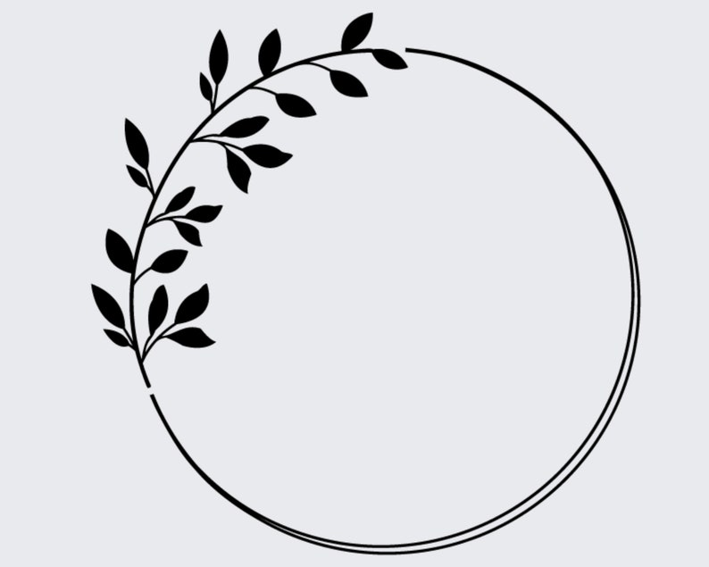 May include: A black and white floral wreath with a circle in the center. The wreath is made of leaves and branches.