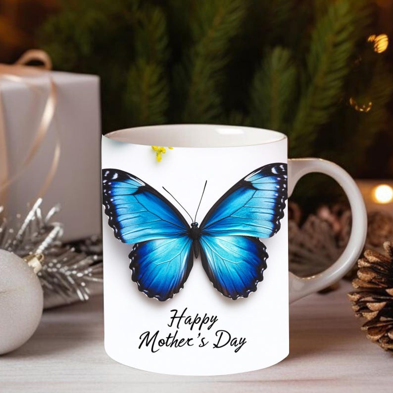 May include: White ceramic mug with a blue butterfly design and the text "Happy Mother's Day".