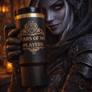 May include: Black travel mug with gold accents and the text "TEARS OF MY PLAYERS". The mug features a D20 dice design. The image shows a person with dark skin, red eyes, and pointed ears holding the mug.
