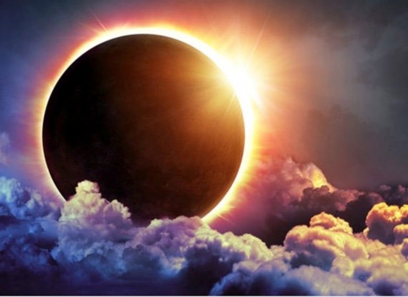 May include: A solar eclipse with the moon passing in front of the sun, creating a ring of light around the moon. The eclipse is visible through a layer of clouds.