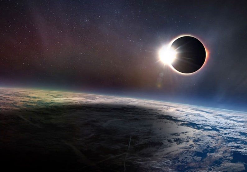 May include: A total solar eclipse with the sun's corona visible as a bright ring of light around the moon's silhouette. The Earth's atmosphere and clouds are visible in the foreground.