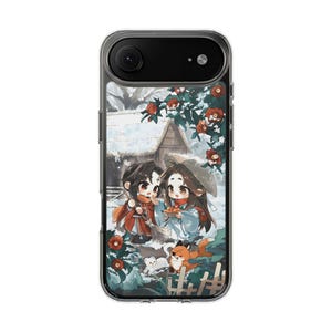 Puede incluir: Funda de teléfono transparente con una colorida ilustración de dos personajes de estilo anime en una escena nevada con una pequeña casa, flores y un zorro. La funda tiene una lente de cámara negra y un borde transparente.