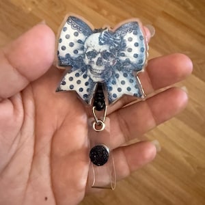 Skull badge reel