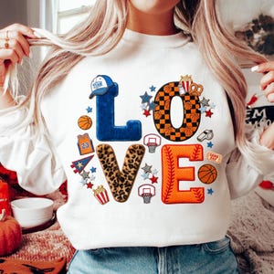 May include: A set of three ceramic nesting bowls in shades of blue, green, and white. The bowls feature a speckled glaze and a simple, modern design. The largest bowl measures approximately 6 inches in diameter.