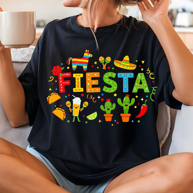 May include: Black t-shirt with a colorful "Fiesta" graphic featuring a pinata, maracas, tacos, cacti, and a lime.