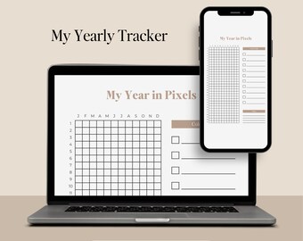 May include: A laptop and smartphone displaying a yearly tracker. The laptop screen shows a grid for monthly tracking, labeled "My Year in Pixels." The smartphone mirrors the design. Text at the bottom reads "Printable PDF."