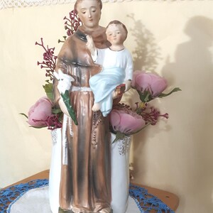St. Anthony and Child Figurine/Planter Including Vintage Plastic Flowers