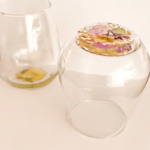 Handcrafted, stemless wine glasses with real and pressed flowers on the bottom of the glass with gold leaf accents. Mother's Day Gift, Bridesmaid Gift, Bridal Shower.