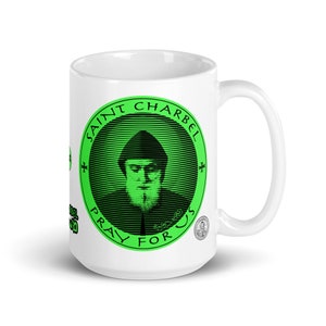 Saint Sharbel Green Mug 15 oz. Mar Charbel was a Lebanese, Maronite & Catholic Saint. St Charbel was a Hermit, Monk, and Priest. Mug 15 oz.