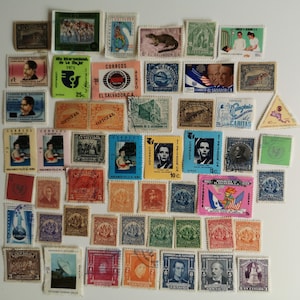 May include: A collection of vintage postage stamps from El Salvador. The stamps feature a variety of designs, including a woman with a flower, a man wearing a hat, a building, and a child. The stamps are in different colours and sizes. Some of the stamps have text in Spanish, including "Correos El Salvador" and "10c."