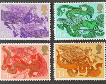 May include: A set of four vintage British postage stamps featuring angels playing musical instruments. The stamps are in shades of purple, green, orange, and red. The stamps are from 1971 and feature the text "6 1/2p", "8 1/2p", "11p", and "13p".