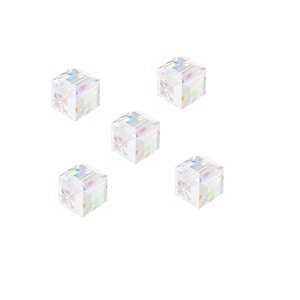 May include: Five iridescent clear glass cube beads. The beads are small and have a rainbow effect.