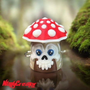 May include: A 3D printed mushroom figurine with a white skull face and red and white spotted cap.