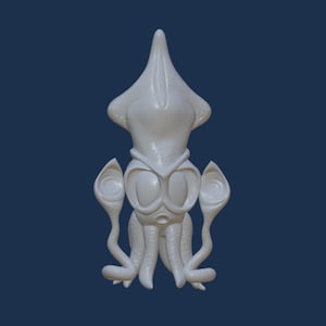 May include: White ceramic sculpture of a squid with large eyes and tentacles. The squid has a cartoonish appearance.