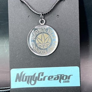 Classy cannabis necklace, Laser engraved stainless steel says, Alcohol Ki*ls, Chills with an engraved cannabis leaf