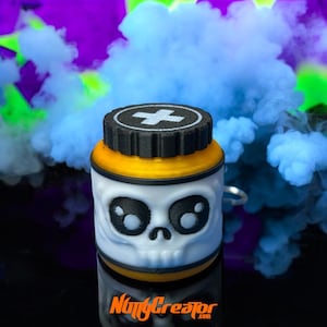 May include: A white and yellow container with a skull face design. The container has a black lid with a white cross symbol. The bottom of the container has the text "NiftyCreator.com". The background features blue and purple smoke.
