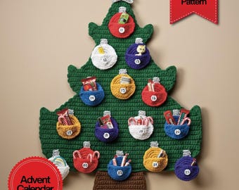 May include: A handmade green crochet Christmas tree advent calendar with 12 numbered pockets, each holding small gifts. The tree is adorned with a star and has a brown base. The image includes the text "Advent Calendar" and "PDF Download Pattern".