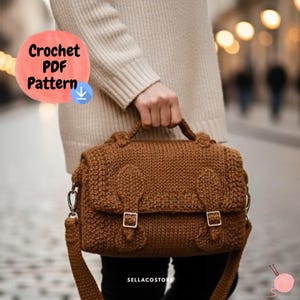 May include: A brown crochet bag with a flap closure and a shoulder strap. The bag has two buckles and decorative elements on the front. The text "Crochet PDF Pattern" is in a red circle. The bag is held by a person.