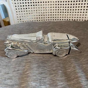 Vintage - Bottiglia Avon - Anni '70 - Auto Duesenberg color argento - Profumo di campagna selvaggia - Argento - Parte superiore in plastica nera (coperchio) - 6 Fl Oz.
