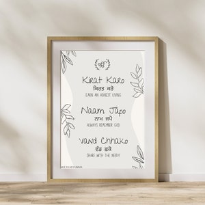 May include: A black and white printable wall art print with a quote in Punjabi and English. The quote says "Kirat Karo, Earn an honest living. Naam Japo, Always remember God. Vand Chhako, Share with the needy." The print features a simple floral design and the symbol of the Sikh faith.