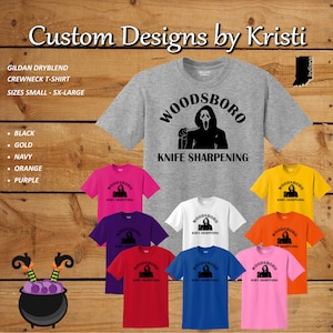 May include: A collection of t-shirts featuring a black and white graphic of a masked figure holding a knife with the text "WOODSBORO KNIFE SHARPENING". The shirts are available in black, gold, navy, orange, purple, pink, red, white, and light blue.